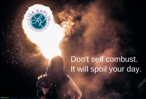 A color photo of a person in shadow with a what looks like flames springing from their head. In the top left corner over the white flames is the Lisa Kaplin logo. In the bottom right is the text “Don't self combust. It will spoil your day.”