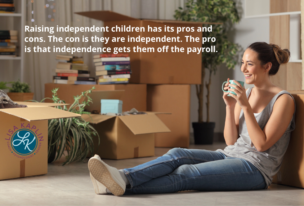 A color photo of a young, white woman sitting on the floor and smiling as she drinks a cup of coffee. she is surrounded by boxes in various stages of unpacking. The text at the top reads “Raising independent children has its pros and cons. The con is they are independent. The pro is that independence gets them off the payroll.” The Lisa Kaplin logo is in the bottom left corner.