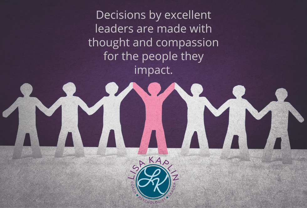A color photo of silhouettes of people cut out of paper. They are holding hands and are all light grey except for the one in the center, which is pink. The text in the center above the figures reads “Decisions by excellent leaders are made with thought and compassion for the people they impact.“ The Lisa Kaplin logo is in the center beneath the figures.